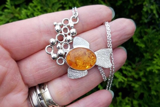 amber fish necklace on hand (6) best cropped